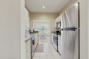 Fridge, microwave, oven, stovetop - Well-stocked Creekwood townhome with pool, balcony, board games, W/D, & AC (Rehoboth Beach)
