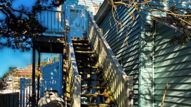 A staircase leading to a building with a blue exterior. - Town of Rehoboth Beach dog-friendly house close to beach & restaurants (Rehoboth Beach)