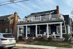 A two-story house with a porch, a chimney, and a car parked in front. - Town of Rehoboth Beach dog-friendly house close to beach & restaurants (Rehoboth Beach)