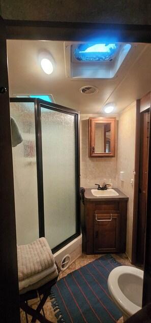 Shower, hair dryer, towels, soap