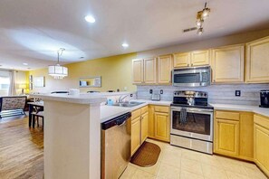 Fridge, microwave, oven, stovetop - The Palms water-view condo near beach with outdoor pool, streaming, W/D, & AC (Rehoboth Beach)