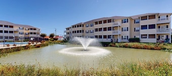 The Palms water-view condo near beach with outdoor pool, streaming, W/D, & AC