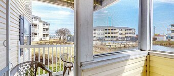 The Palms water-view condo near beach with outdoor pool, streaming, W/D, & AC