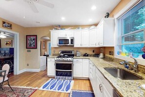 Fridge, microwave, oven, stovetop - Dog-friendly 2-story home near beach with screened porch, fast WiFi, W/D, & AC (Rehoboth Beach)