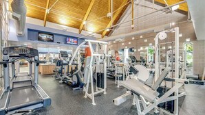 A gym with treadmills, weight machines, and exercise equipment. - Bear Trap Dunes townhouse w/ gym, pool, free WiFi, and golf on-site (Ocean View)