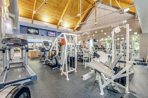 A gym with treadmills, weight machines, and exercise equipment. - Bear Trap Dunes townhouse w/ gym, pool, free WiFi, and golf on-site (Ocean View)