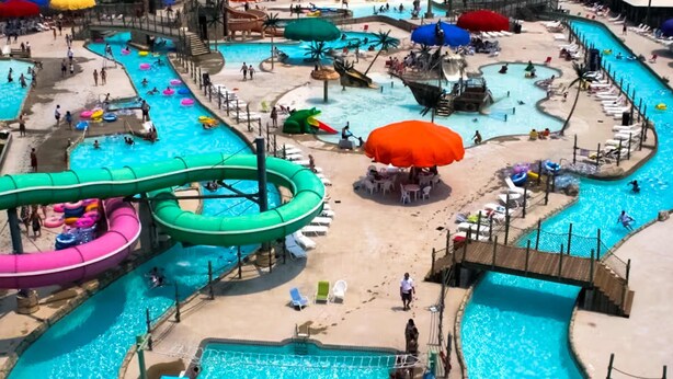 A water park with multiple pools, slides, and inflatable rings. - Rehoboth Beach dog-friendly, hot tub, game room, and Washer/Dryer (Rehoboth Beach)