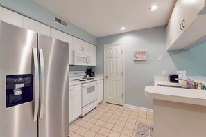 Fridge, microwave, oven, stovetop - Sea Colony condo with pool, hot tub, sauna, fitness room, gas fireplace & deck (Bethany Beach)