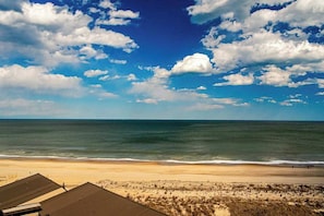 A beach view with a clear sky and ocean. - Sea Colony ninth floor condo with shared pool, hot tub & ocean views (Bethany Beach)