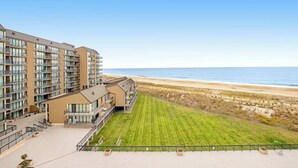 A multi-story hotel with balconies overlooking a beach. - Sea Colony Ocean 6th floor condo w/ pool, gym, and free WiFi (Bethany Beach)