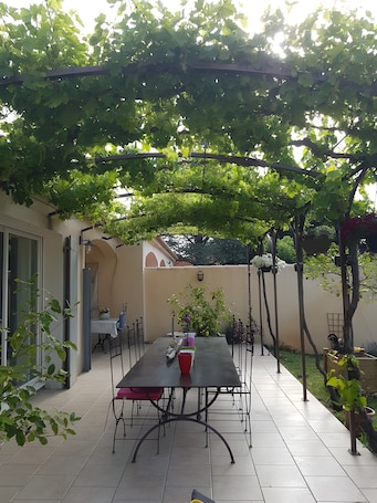 Outdoor dining. Bed and Breakfast 'Fleur De Garance' with Shared Pool, Private Terrace and Wi-Fi