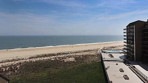A beachfront hotel with a pool, beach access, and a view of the ocean. - Sea Colony 7th-floor ocean-view condo with elevator & gym (Bethany Beach)