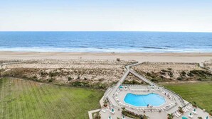 A pool area with a view of the beach and ocean. - Sea Colony Ocean 14th floor condo with WiFi, basketball court, and tennis court (Bethany Beach)