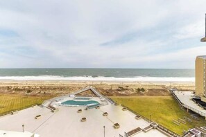 A rooftop pool area with a view of the beach and ocean. - Sea Colony Ocean 7th floor condo w/free WiFi, tennis court, and elevator (Bethany Beach)