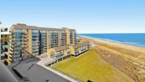A multi-story hotel with balconies overlooking a beach. - Sea Colony Ocean 8th floor condo w/ pool, free WiFi, & basketball court (Bethany Beach)