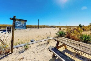A beach with a wooden sign reading 'Sandy Walk,' a wooden bench, and a sandy path. - Sandywalk Townhouse Right on the Beach with Free WiFi, Private Washer/Dryer (Bethany Beach)