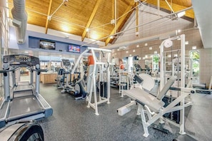 A gym with treadmills, weight machines, and a mirrored wall. - Bear Trap Dunes Lake View Condo w/ WiFi, Shared Pools, Tennis, & Gym - Dogs OK (Ocean View)