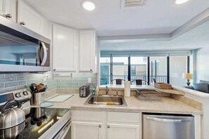 Fridge, microwave, oven, stovetop - Sea Colony oceanfront 2nd floor condo w/ free WiFi, shared sauna, and pool (Bethany Beach)