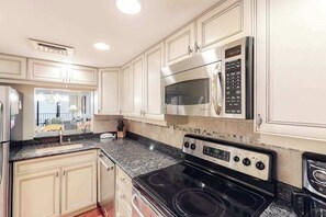 Fridge, microwave, oven, stovetop - Sea Colony 6th floor condo w/ pool, shared sauna & gym - partial ocean view (Bethany Beach)
