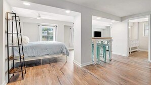 A bedroom with a bed, a ladder, a desk, and a chair. - Dog-friendly town of Fenwick home with guest suite, WiFi, & elevator (Fenwick Island)
