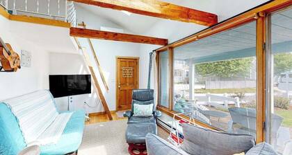 Seaside condo with patio, beach access, loft, board games, gas grill, & firepit