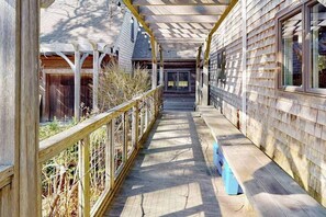 Terrace/patio - Gorgeous woodland home with deck & firepit - walk to ocean bluffs & Rail Trail (Eastham)