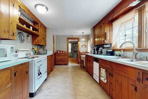 Fridge, microwave, oven, stovetop - Cozy Cape style home near the beach and ferry with patio, W/D, & AC (Hyannis)