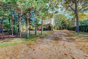 Property grounds - 2-story home near the beach with large lawn, deck, W/D, streaming, & partial AC (Falmouth)