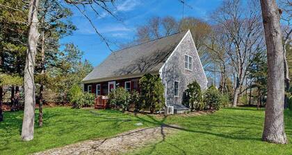 2-story home near the beach with large lawn, deck, W/D, streaming, & partial AC