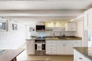Fridge, microwave, oven, stovetop - Modern & bright condo with patio, W/D, and central location near town & beach (Provincetown)