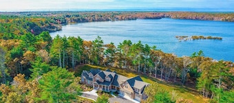 Incredible home on lake with views, private beach, deck, AC, & W/D