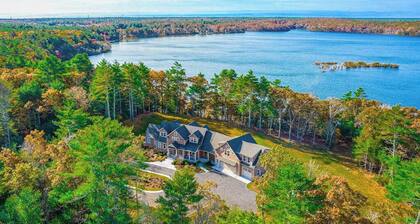 Incredible home on lake with views, private beach, deck, AC, & W/D