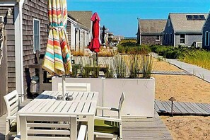 Outdoor dining - Quiet cottage on the beach with deck, grill, AC, & water views (Truro)
