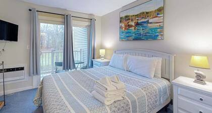Cozy condo with golf course view, balcony, W/D, AC, & games