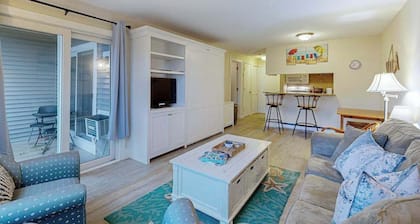 Cozy condo with golf course view, balcony, W/D, AC, & games