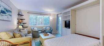 Cozy condo with golf course view, balcony, W/D, AC, & games