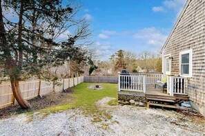 Terrace/patio - Two-story dog-friendly retreat with enclosed yard, playset, W/D, & firepit (Harwich)