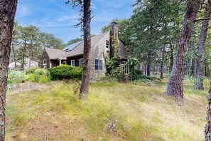Exterior - Serene wooded hideaway with spacious deck & Rail Trail access - near beach (Wellfleet)