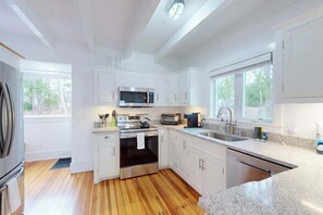 Fridge, microwave, oven, stovetop - Inviting home + apartment near beach with furnished deck, yard, & grill (Bourne)
