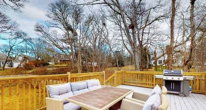 Inviting home + apartment near beach with furnished deck, yard, & grill