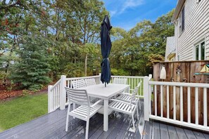 Outdoor dining - Inviting dog-friendly home with furnished deck & firepit, near golf (East Falmouth)