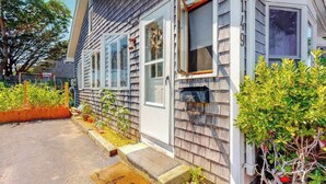 A residential house with a front door, windows, and a mailbox. - Family Friendly Falmouth Beach House with Ocean Views and BBQ Grill (Falmouth)