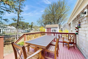 Outdoor dining - Family getaway in great location with deck, board games, yard, & AC (Dennis Port)