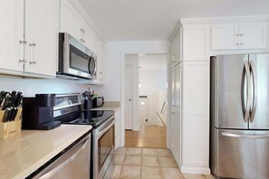 Fridge, microwave, oven, stovetop - Spacious house close to town and beach with AC, W/D, games, deck, & grill (Dennis Port)