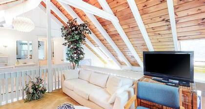 Summer home with expansive deck & wonderful location for beachgoers