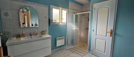 Shower, hair dryer, towels, soap