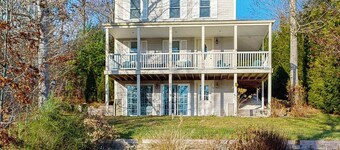 Spacious home close to Peters Pond Beach with porch, AC, W/D, & water view