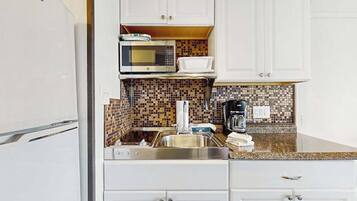 Fridge, microwave, stovetop, coffee/tea maker