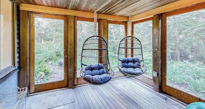 Charming 2-story house near the beach with inviting deck, large yard & canoe