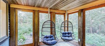 Charming 2-story house near the beach with inviting deck, large yard & canoe